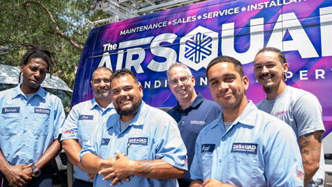 The Air Squad technicians standing in front of van